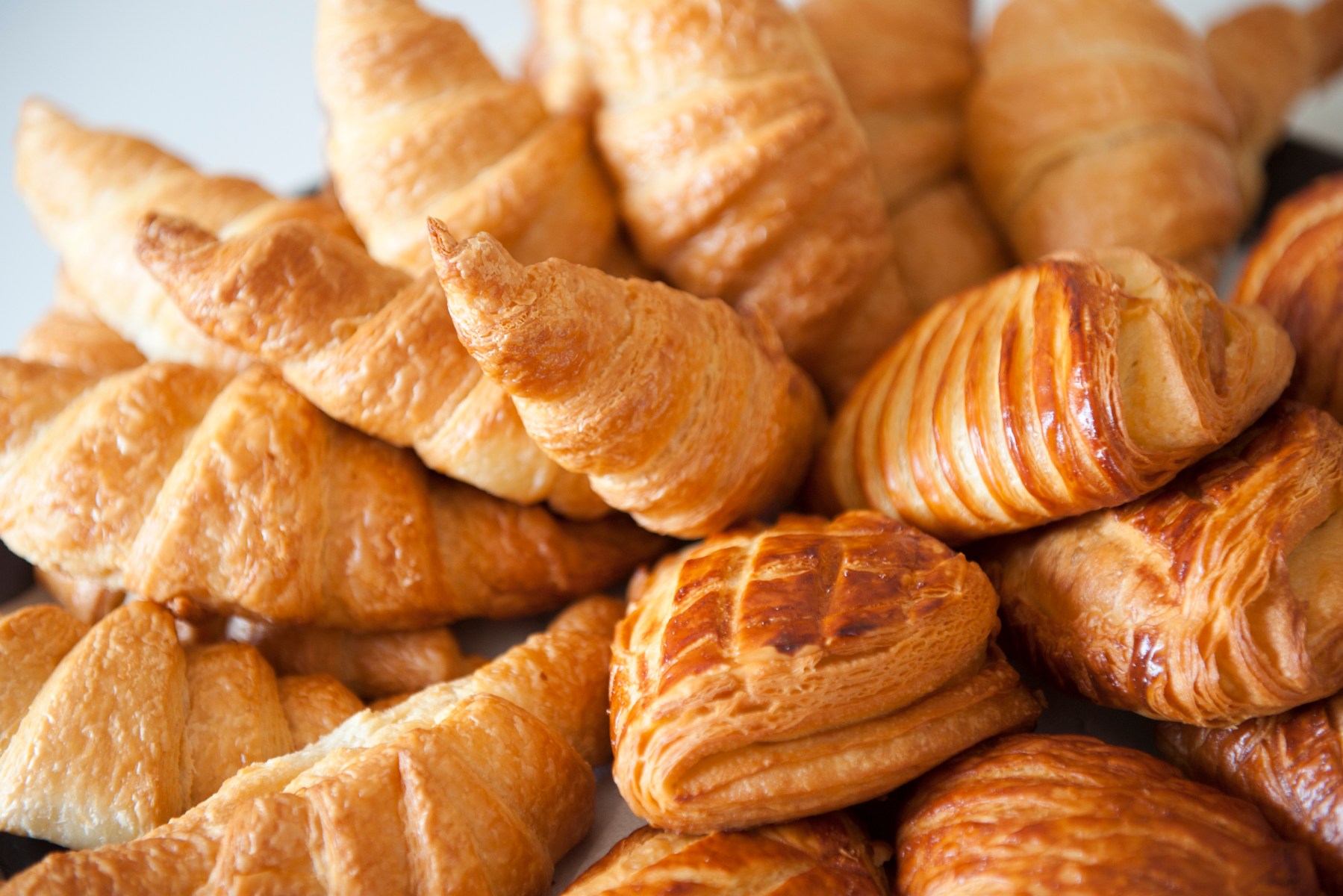 Golden croissants piled together